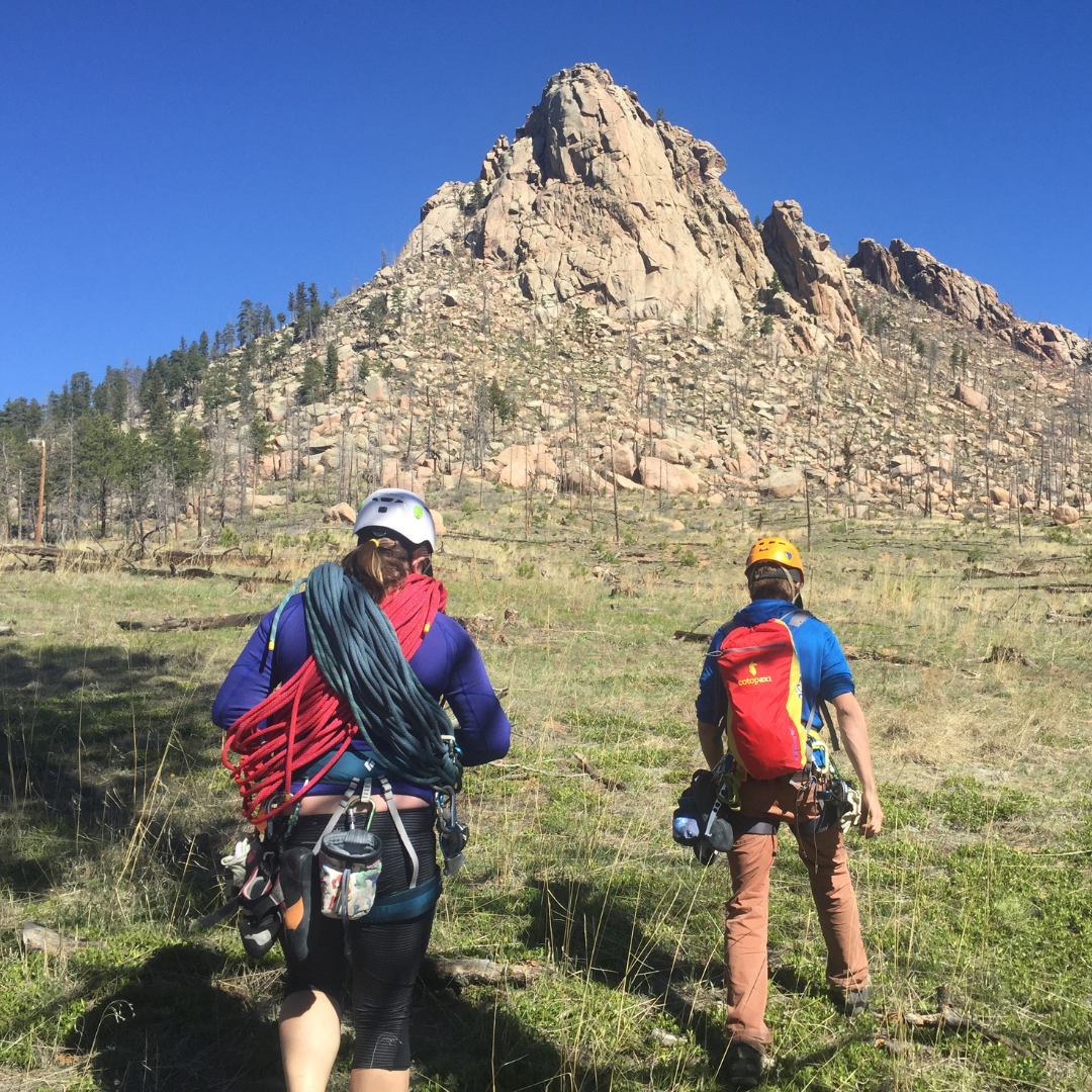 Two climbers approaching Sheep's Nose to climb Lost in Space